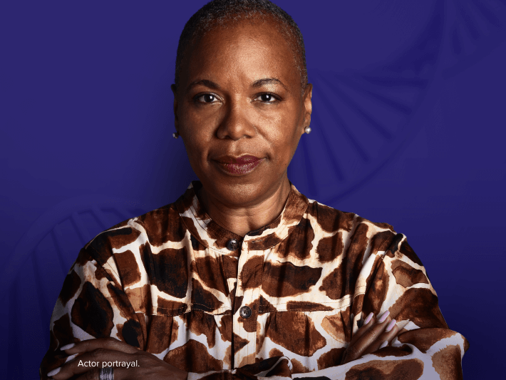 A headshot of a patient against a blue background, overlaid with a translucent image of a DNA strain